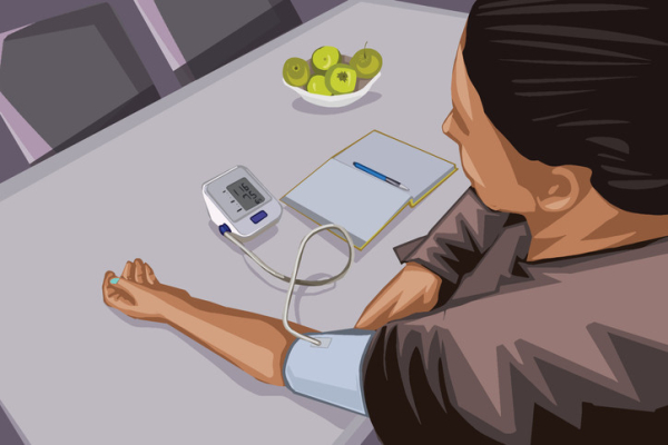 Illustration of dark-haired woman seated at table, arm extended, using a blood pressure monitor; notebook and a bowl of green apples near her